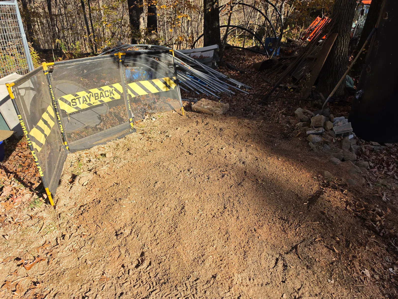 After stump grinding: Stump ground out behind the chip curtain in Brimfield, MA